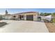 Wide shot of a single story home with concrete driveway, red tiled roof, stucco walls, and single garage door at 186 45Th Ave, St Pete Beach, FL 33706