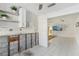 Kitchen showcasing modern white cabinets, floating shelves and is open to the studs for remodel at 186 45Th Ave, St Pete Beach, FL 33706