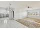 Open living area to kitchen showcasing tile flooring and lots of natural light at 186 45Th Ave, St Pete Beach, FL 33706