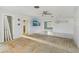 Bright and spacious living room area, with open doorway, ceiling fan, and ready for flooring updates at 186 45Th Ave, St Pete Beach, FL 33706