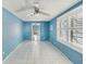 Bright and airy living room with tile floors, ceiling fan, and wide window to let in light at 186 45Th Ave, St Pete Beach, FL 33706