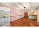 Elegant dining room with wood floors, stylish lighting, and an open layout to the living room and kitchen at 2115 Seagull Dr, Clearwater, FL 33764