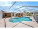 Screened-in pool with an in-ground spa and spacious patio for relaxing and entertaining in this lovely Florida home at 2115 Seagull Dr, Clearwater, FL 33764