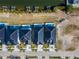 Aerial view of new waterfront homes featuring sleek, black roofs, private pools, and boat docks at 6540 Simone Shores Cir, Apollo Beach, FL 33572