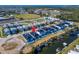 Aerial view shows new waterfront homes near open water with community features and boat access at 6540 Simone Shores Cir, Apollo Beach, FL 33572
