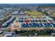 Aerial view showcases waterfront homes in a planned community with boat docks and nearby amenities at 6540 Simone Shores Cir, Apollo Beach, FL 33572