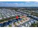 A community aerial view shows proximity to waterways and nearby properties in a well-kept neighborhood at 6540 Simone Shores Cir, Apollo Beach, FL 33572