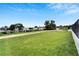 Expansive backyard with a large grassy area, perfect for outdoor activities at 6540 Simone Shores Cir, Apollo Beach, FL 33572