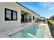 Stylish backyard featuring a pool and spa with modern design and serene outdoor charm at 6540 Simone Shores Cir, Apollo Beach, FL 33572