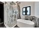 Elegant bathroom features a large glass shower and a luxurious soaking tub at 6540 Simone Shores Cir, Apollo Beach, FL 33572