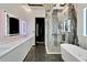 Luxurious bathroom featuring double vanity, large shower, and modern bathtub at 6540 Simone Shores Cir, Apollo Beach, FL 33572