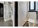 Modern bathroom featuring a stylish shower and a sleek toilet at 6540 Simone Shores Cir, Apollo Beach, FL 33572