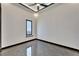 Minimalist bedroom design with a large window and modern ceiling fan at 6540 Simone Shores Cir, Apollo Beach, FL 33572