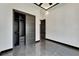 Modern bedroom featuring stylish gray floors, an open closet, and modern doorframes at 6540 Simone Shores Cir, Apollo Beach, FL 33572