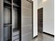 Modern closet with sliding doors and built-in drawers, seamlessly integrated into bedroom design at 6540 Simone Shores Cir, Apollo Beach, FL 33572