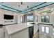 Spacious open kitchen featuring a modern island and wet bar at 6540 Simone Shores Cir, Apollo Beach, FL 33572