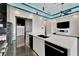Modern kitchen with a sink, island and stainless steel dishwasher at 6540 Simone Shores Cir, Apollo Beach, FL 33572
