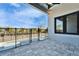 Covered patio with a view of the private pool enclosed by secure fencing at 6540 Simone Shores Cir, Apollo Beach, FL 33572