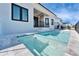 Backyard view of private pool with access steps and modern home exterior at 6540 Simone Shores Cir, Apollo Beach, FL 33572