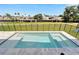 Inviting pool with attached spa featuring clear blue water with a fenced backyard and landscaping at 6540 Simone Shores Cir, Apollo Beach, FL 33572