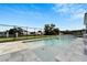 Backyard view of private pool with paved deck and black fencing offering both relaxation and security at 6540 Simone Shores Cir, Apollo Beach, FL 33572