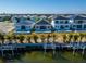 This back exterior view highlights waterfront access, private pools, and modern home designs at 6540 Simone Shores Cir, Apollo Beach, FL 33572