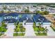 Aerial view of two modern homes with paved driveways at 6540 Simone Shores Cir, Apollo Beach, FL 33572