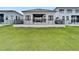 Modern house exterior with a fenced backyard at 6540 Simone Shores Cir, Apollo Beach, FL 33572