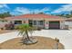 Single-story home with circular driveway and landscaping at 186 45Th Ave, St Pete Beach, FL 33706