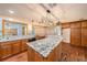 Large kitchen with granite countertops and updated appliances at 2115 Seagull Dr, Clearwater, FL 33764