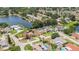 Aerial view showing the property's location near a lake and surrounding homes at 2115 Seagull Dr, Clearwater, FL 33764