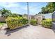 Two-toned storage sheds nestled in a landscaped backyard at 2115 Seagull Dr, Clearwater, FL 33764