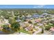 Wide aerial view of neighborhood and waterfront property at 2115 Seagull Dr, Clearwater, FL 33764