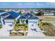 Aerial view of a residential community showcasing well-designed homes with lush landscaping and modern amenities at 6542 Simone Shores Cir, Apollo Beach, FL 33572