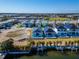 An aerial view displaying waterfront homes, colorful exteriors, and waterway access at 6542 Simone Shores Cir, Apollo Beach, FL 33572