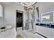 Luxurious bathroom featuring a marble shower, free-standing tub, elegant lighting, and a spacious walk-in closet at 6542 Simone Shores Cir, Apollo Beach, FL 33572