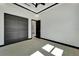 Bright bedroom with modern black trim, neutral carpet, and a view through to the bathroom at 6542 Simone Shores Cir, Apollo Beach, FL 33572