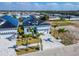 The house has a front yard with palm trees, a paved driveway, and a beautifully landscaped front yard at 6542 Simone Shores Cir, Apollo Beach, FL 33572
