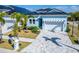 Charming single-Gathering home with a well-manicured lawn, attractive landscaping, and a welcoming two-car garage at 6542 Simone Shores Cir, Apollo Beach, FL 33572