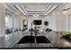 Kitchen featuring high-end black granite countertops and modern appliances with an open view to the living room at 6542 Simone Shores Cir, Apollo Beach, FL 33572