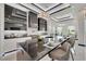 Gourmet kitchen with a waterfall countertop, bar seating, modern appliances, and beautiful pendant lighting at 6542 Simone Shores Cir, Apollo Beach, FL 33572