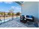 Outdoor patio with comfortable seating and a safety fence enclosing the swimming pool at 6542 Simone Shores Cir, Apollo Beach, FL 33572