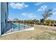 Backyard pool features a secure fence and landscaping for fun outdoor enjoyment at 6542 Simone Shores Cir, Apollo Beach, FL 33572