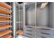 Custom walk-in closet with shelving, drawers, and a rotating accessory carousel at 6542 Simone Shores Cir, Apollo Beach, FL 33572