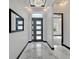 Bright and spacious entryway with marble floors and a large mirror at 6542 Simone Shores Cir, Apollo Beach, FL 33572