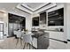Sleek kitchen featuring black cabinetry, quartz countertops, and stainless steel appliances at 6542 Simone Shores Cir, Apollo Beach, FL 33572