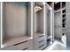 Bright walk-in closet with ample hanging space and drawers at 6542 Simone Shores Cir, Apollo Beach, FL 33572