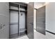 Spacious walk-in closet with hanging rods and shelves at 6542 Simone Shores Cir, Apollo Beach, FL 33572