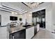 Open concept kitchen with island, wine fridge, and stainless steel appliances at 6542 Simone Shores Cir, Apollo Beach, FL 33572