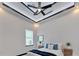 Well-lit bedroom with ceiling fan, window, and carpeted floor at 6542 Simone Shores Cir, Apollo Beach, FL 33572
